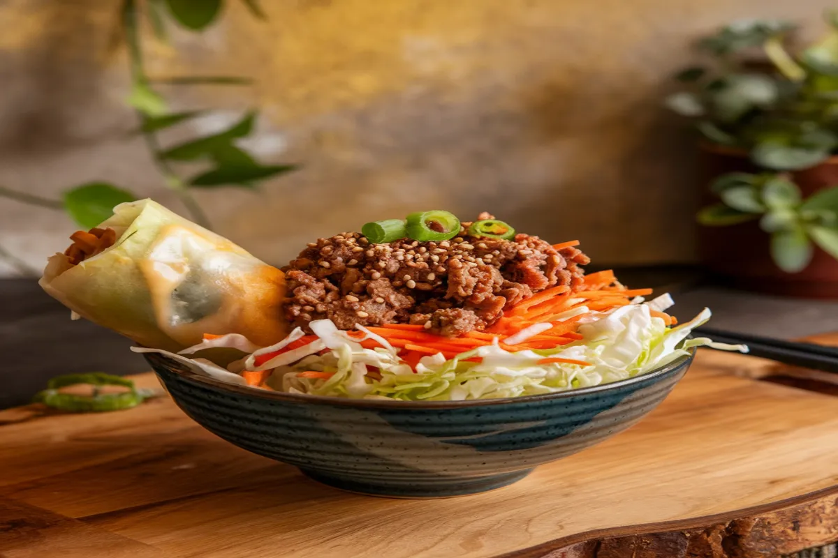 Egg roll in a bowl with cabbage and ground meat